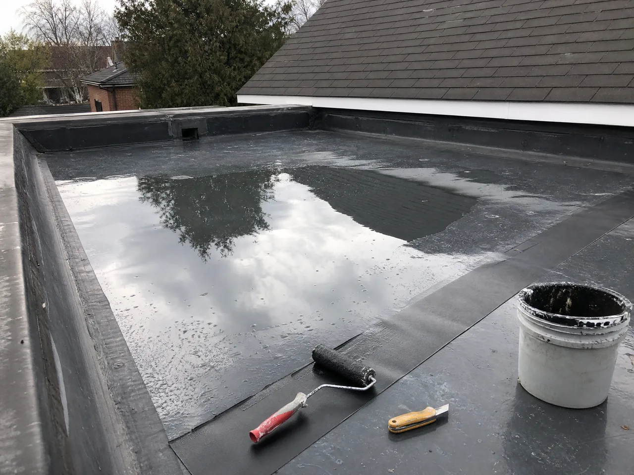 Low-slope flat roof membrane repair on a building in Aurora IL