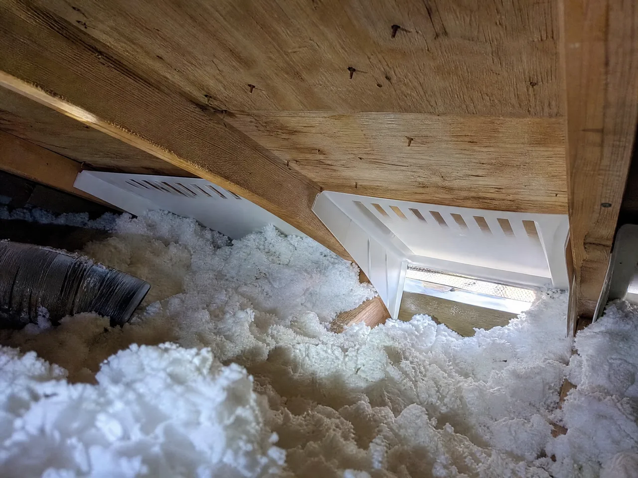 Ridge vent and baffled soffit intake installed on an Aurora Illinois roof
