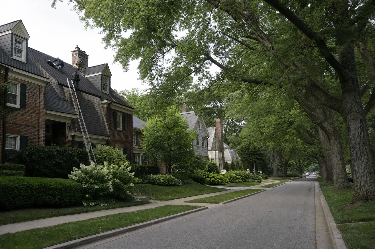 Roofing crew working on a tree-lined residential street in Naperville IL
